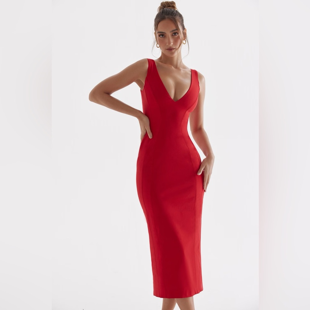 Vibrant red midi dress. Stretch sculpting fabric, plunging v-neckline.
